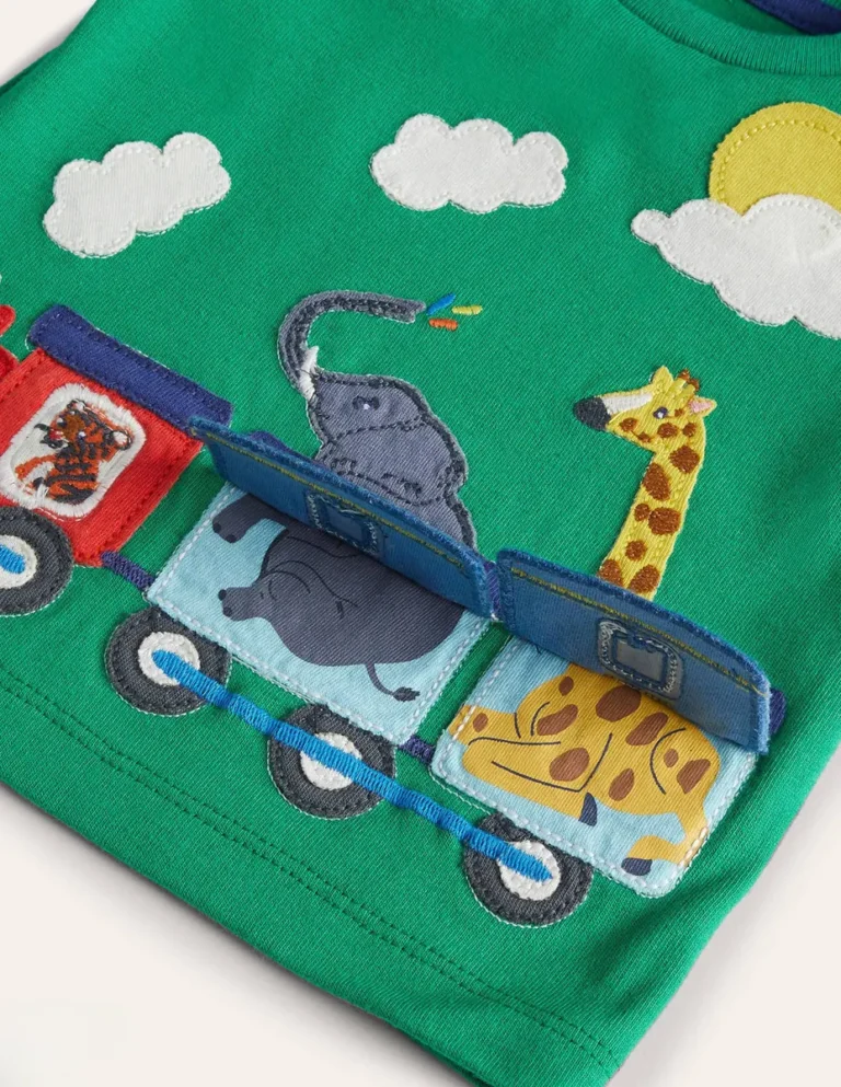 Appliqué train carrying an elephant and giraffe with lift-up flaps on a green kids T-shirt