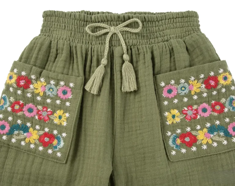 Multicolor floral embroidery on the front pockets of olive green kids shorts