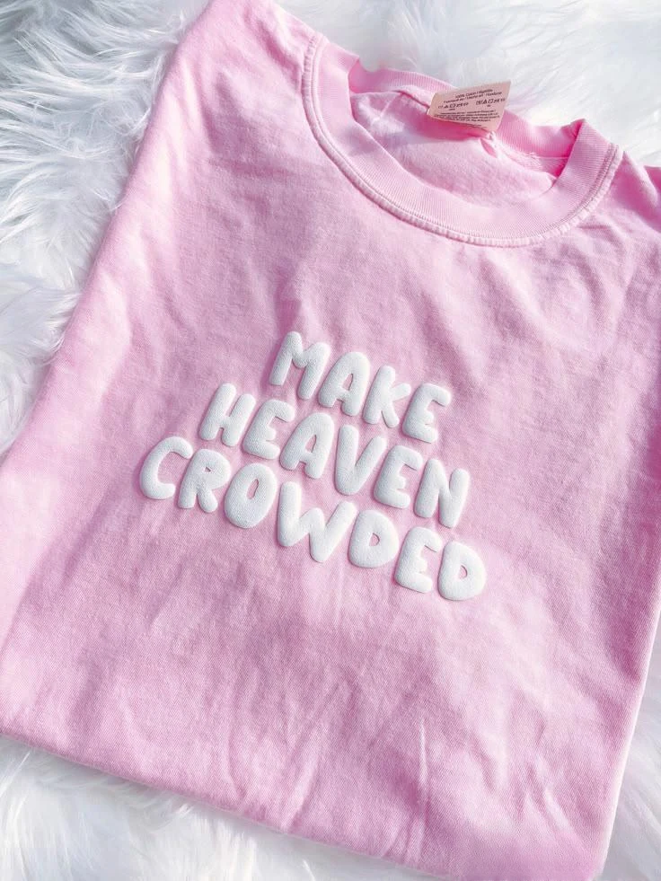 White puff-printed slogan lettering on a pink T-shirt