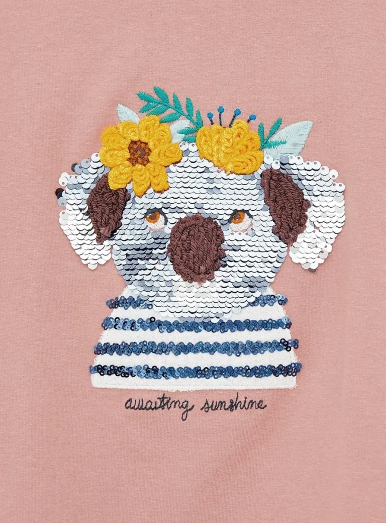 Sequin koala in a striped top with embroidered flower crown on a pink sweatshirt