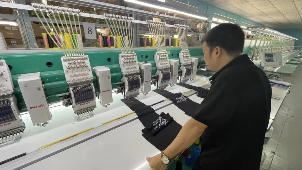 Operator working with a multi-head embroidery machine